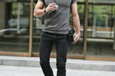 With gray t-shirt, black hat and ankle boots