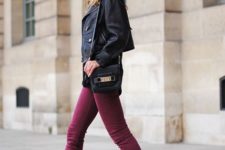 With leather jacket, small bag and purple pants