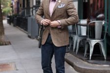 With pink shirt, bow tie, tweed jacket and jeans