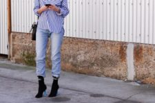 With striped loose shirt, jeans and black bag