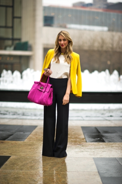 With white blouse, black wide-leg pants and purple bag