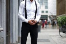 With white button down shirt, black suspenders and shoes