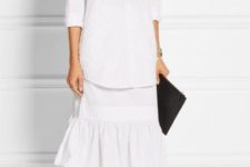 With white long shirt, midi skirt and black clutch