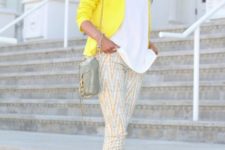 With white loose shirt, printed crop pants and small bag