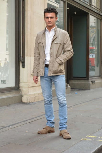 With white shirt, beige jacket and jeans