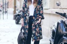 With white shirt, jeans, floral coat and wide brim hat