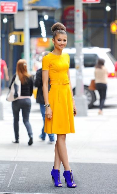 With yellow knee length dress