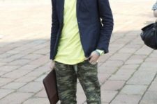 With yellow shirt, navy blue blazer and sneakers