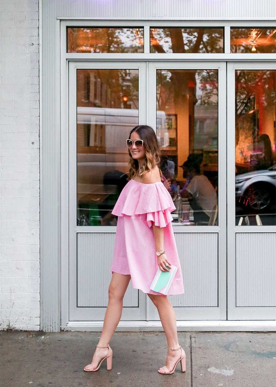 pink off the shoulder ruffle dress, blush heels and a blutch