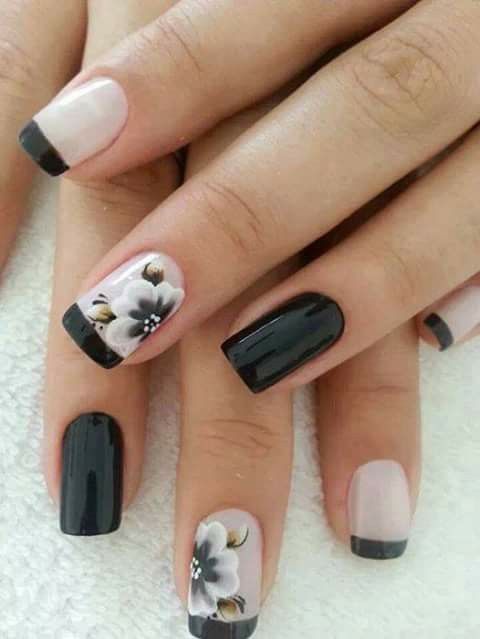 black and blush French manicure with two black nails and flowers