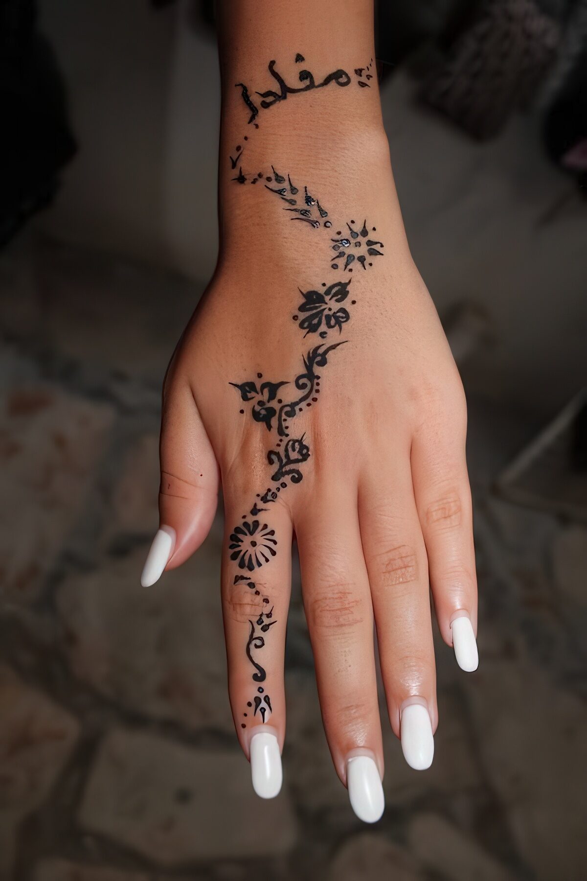 Woman Hand Showing Medium Finger Uphenna Tattoo High-Res Stock Photo -  Getty Images