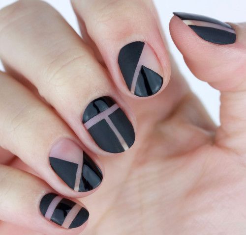 black geometric negative space nails with mismatching patterns