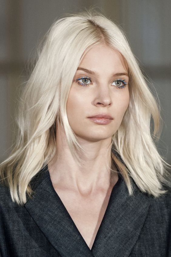 medium-length icy blonde hair with light waves