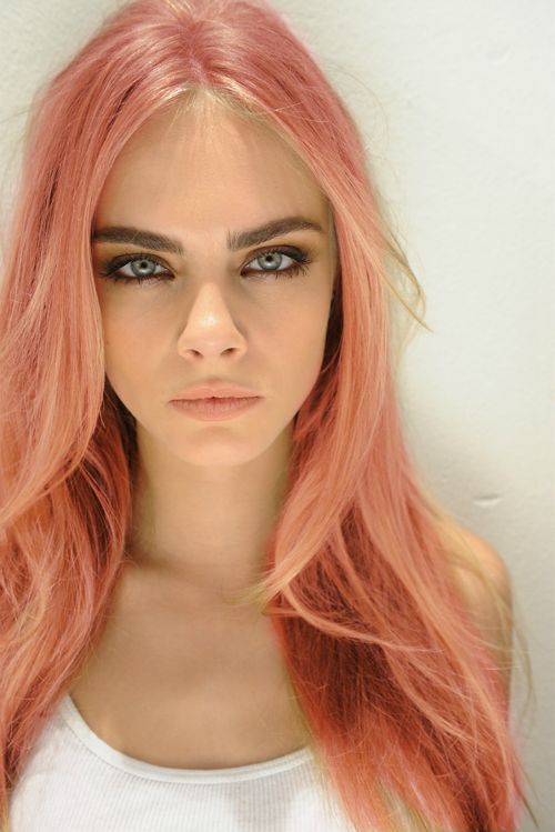 Cara Delevigne with a shade of rose gold on her hair