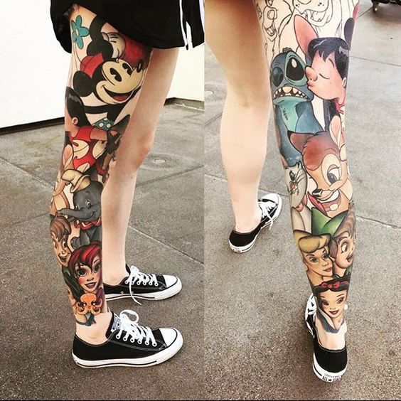 a whole leg covered with a colorful Disney-theme tattoo