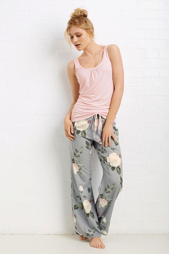 a set of pjs with a blush top and grey floral pants