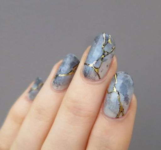 grey marble with gold cracks nail art