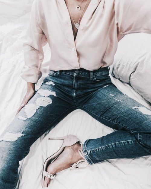 a blush blouse, ripped jeans and blush heels