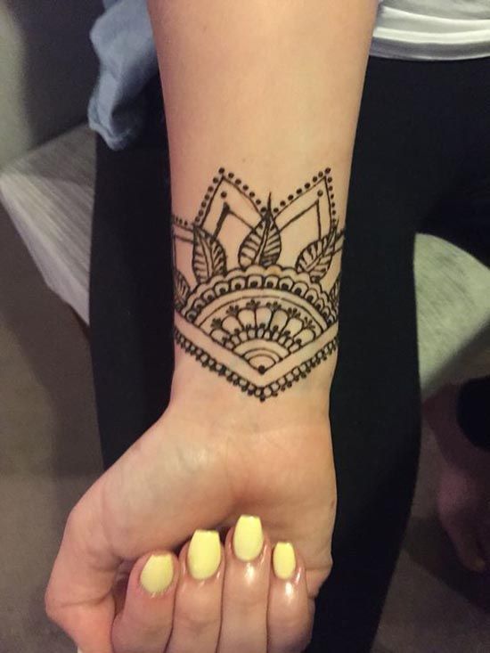 2temporary henna tattoo with a geometric feel and some botanicals