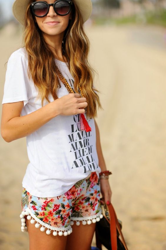 a printed tee, floral shorts with a pompom trim