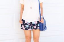 14 a white tee, black floral shorts and nude peep toe heels