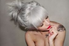 14 grey blonde hair, a large fringe and an updo