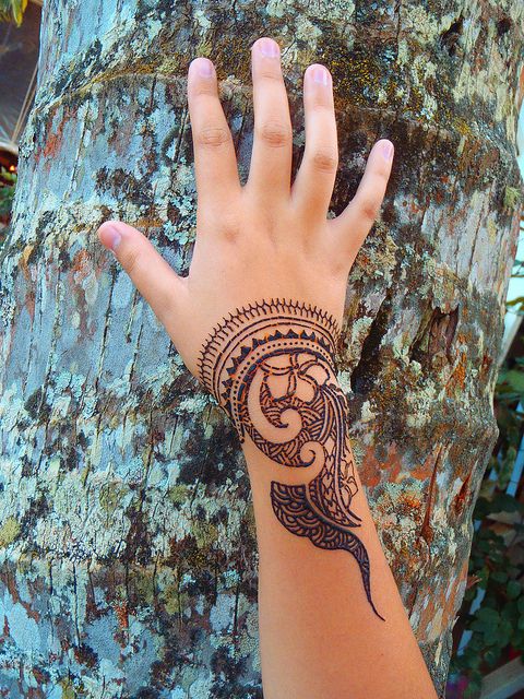 Polynesian style henna on the wrist and arm