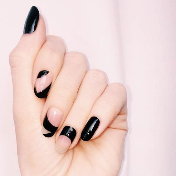 black and negative space asymmetrical nails