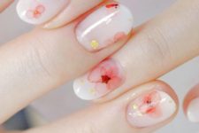 18 glossy white nails with natural-looking red flowers