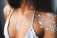 20 boho-inspired white henna tattoo on the shoulders and chest