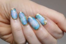 21 blue and pink marbelized nails with gold framing