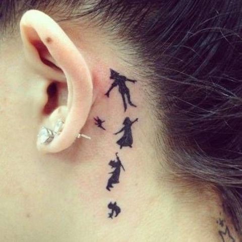 black ink Peter Pan tattoo behind the ear