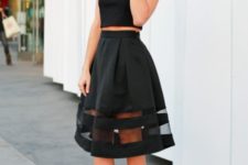 With black crop top and classic pumps