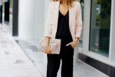 With black jumpsuit, printed clutch and pumps