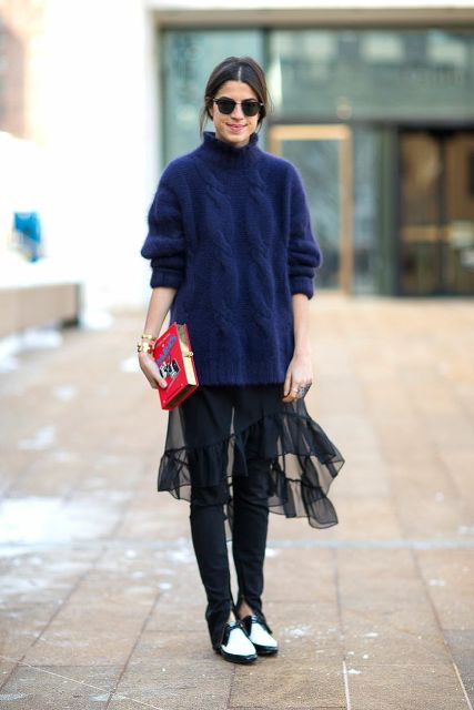With black pants, two color shoes and sweater