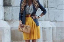 With blouse, blue blazer, brown belt, beige clutch and white shoes