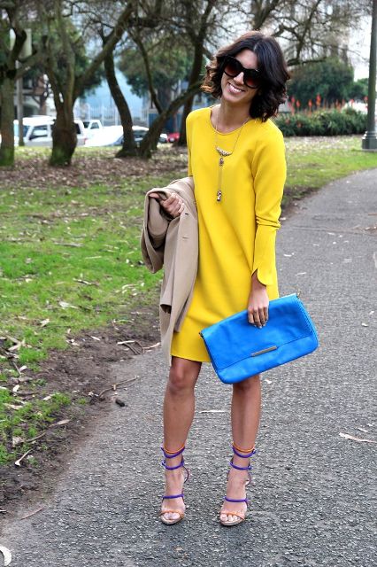 With blue clutch and colored sandals