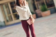 With cream shirt, marsala pants and clutch