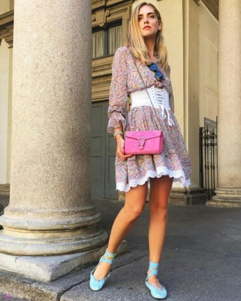 With floral dress, lace up flats and fuchsia bag