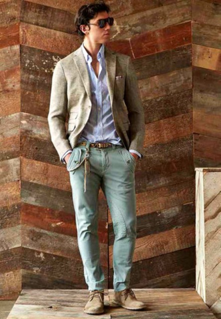With gray blazer and beige boots