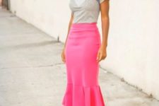 With gray shirt and hot pink pumps