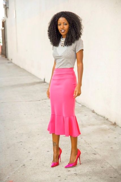 With gray shirt and hot pink pumps