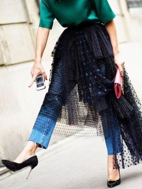 With green shirt, jeans, black pumps and red clutch