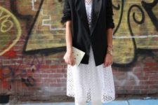 With lace shirt, white pants, ankle boots and black blazer