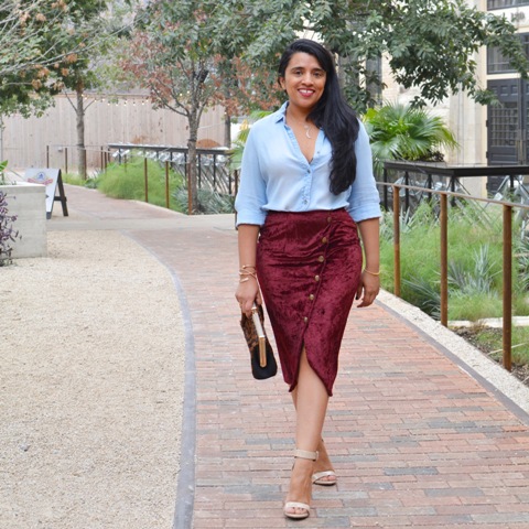 With light blue shirt, sandals and clutch