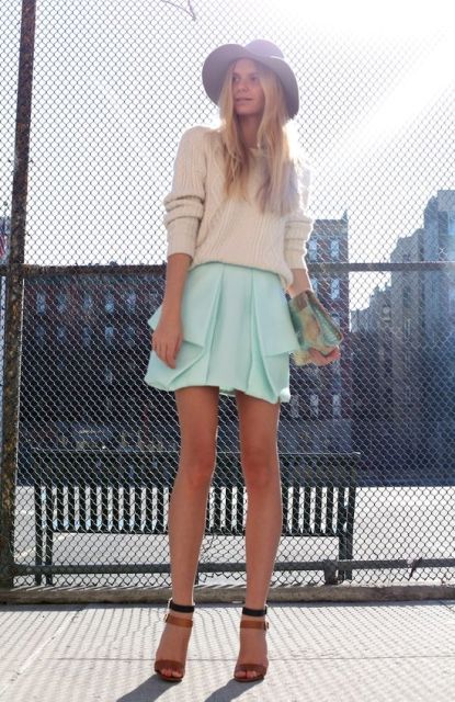 With oversized sweater, two color shoes, hat and printed clutch