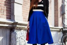 With striped shirt, black jacket, blue beret, red bag, polka dot tights and ankle boots