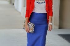 With t-shirt, red blazer and printed clutch