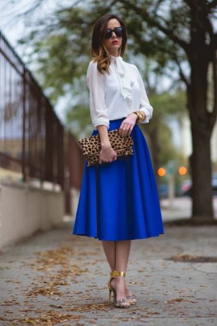 With white blouse, leopard clutch and metallic sandals