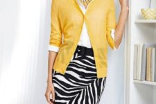 With white blouse, yellow cardigan and black belt